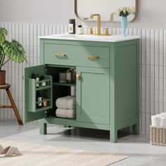 a bathroom with a green cabinet and sink