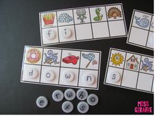 three matching game pieces with words and pictures on them, including the letter i to u