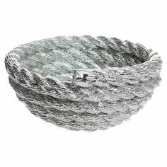 an image of a bowl that is made out of metal wire and has water droplets on it