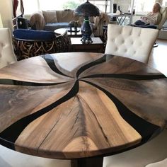 a wooden table sitting in the middle of a living room