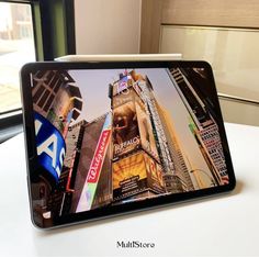 an image of a tablet on a table in front of a window