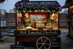 an old fashioned hot dog stand with lots of food