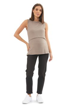 Embrace comfort in this ribbed maternity tank featuring a discreet front flap for nursing. Crewneck Sleeveless 78% polyester, 18% viscose, 4% elastane Machine wash, dry flat Imported Fitted Sleeveless Maternity Tops, Casual Sleeveless Nursing Friendly Tops, Sleeveless Stretch Maternity Top, Nursing Friendly Sleeveless Maternity Tops, Sleeveless Maternity Tops Nursing Friendly, Sleeveless Nursing Friendly Maternity Top, Nursing Crewneck, Nursing Tank, Maternity Nursing