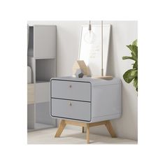 a white and grey dresser next to a potted plant