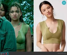 an image of two women in green tops and one is looking at the camera with her hands on her hips