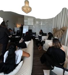 a group of women sitting on couches in a room