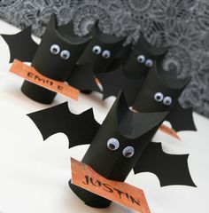 these bats are made out of black paper and have googly eyes on their heads