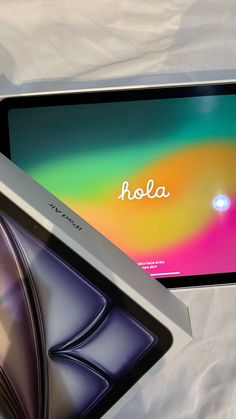 an ipad with the word hola written on it