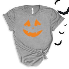 Jack O' Lantern Pumpkin Face graphic in pink or orange. Perfect for this spooky season! Wear to school dress up days, Halloween parties, or just around town for halloween spirit! For All Adult Pumpkin Face T-shirts click here to view.For Adult Sweatshirts click here to view.For Youth/Toddler T-shirts click here to view.For Youth Sweatshirts click here to view.For Baby Bodysuits click here to view. Adult Sizes S-XXL (unisex sizing)Youth Sizes S-XL (unisex Sizing)Toddler Sizes 2T, 3T, 4TBaby Bodysuit Sizes 6 Months, 12 Months, 18 Months Bella + Canvas (Adult, Youth & Toddler T-shirts)4.2 oz. Airlume combed and ring-spun cottonPre-shrunkFor a more relaxed fit, size up! Baby Bodysuit4.5 oz, 100% combed ring-spun cotton fine jerseyInnovative three-snap closure Spooky Orange T-shirt For Fall, Spooky Pre-shrunk T-shirt For Fall, Fall Crew Neck T-shirt For Costume Party, Funny Halloween T-shirt With Screen Print, Fall Costume Party Short Sleeve T-shirt, Fall Short-sleeved T-shirt For Costume Party, Fall Short Sleeve T-shirt For Costume Party, Fun Halloween Costume Party T-shirt, Fun Halloween T-shirt With Screen Print