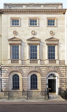 an old building with many windows on the front