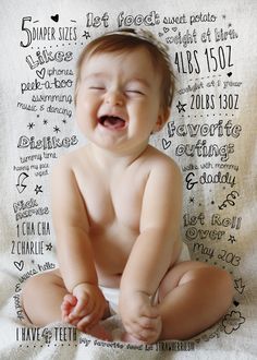 a baby is laughing while sitting on a blanket