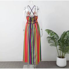 This luxurious and exclusive dress is crafted from a blend of synthetic fibers, ensuring a premium feel and long-lasting quality. Its sophisticated design boasts a colorful stripe pattern, a V-neck halter, a sleeveless silhouette, and a high waist, making it perfect for any high-end occasion. The elegant backless design is accentuated by a zipper closure, adding a touch of refinement. Made with high-quality polyester fabric, this dress exudes luxury and style, making it a must-have for any fashion-forward wardrobe. Designed and produced in China, this ankle-length dress is perfect for the Spring/Summer season. Its O-neckline, natural waistline, and regular fit create a flattering, straight silhouette that is sure to make a statement. With a slight stretch for added comfort, this dress is p Maxi Dres, Ankle Length Dress, Exclusive Dress, Backless Design, Summer Chic, Rainbow Color, Halterneck Dress, Sophisticated Design, High Fashion Street Style