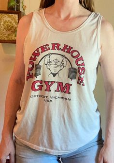 vtg 80s Powerhouse Gym double sided graphic tee weight lifter gym work out tank top paper thin soft muscle tee baggy retro rocky balboa great condition, no areas of stain or damage, worn in and soft Model is size 34 C, 26" Waist, 37"hips 5'5" Measurements Lying Flat: Shoulder:16"-18" Bust:21"-23" waist:21"      Length:26" Sleeve:11"wide Good condition, Light wear and fading Vintage Gym Shirt, Robert Paulson, 80s Gym, Weight Lifter, Rocky Balboa, Fall 24, Club Shirts, Muscle Tee, Gym Shirts