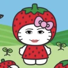 a hello kitty strawberry is standing in the grass