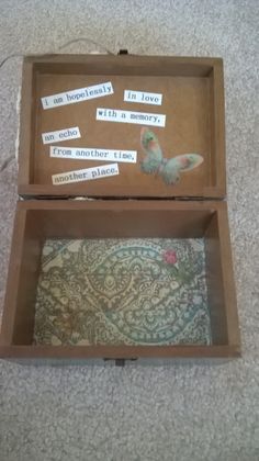 an open box with writing in it on the floor