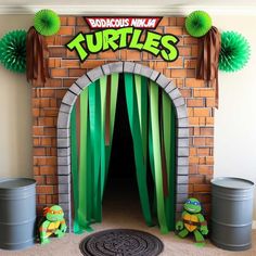 the entrance to a teenage mutant themed birthday party