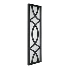 a tall black and white wall light with an intricate design on the glass paneling