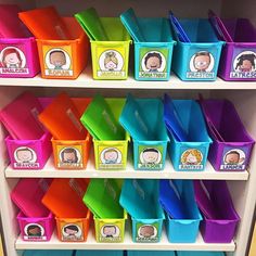 the shelves are filled with different colored bins for children's books and toys