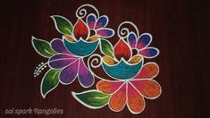 colorful flowers are painted on a wooden surface