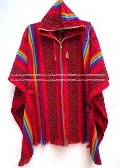 "Our traditional poncho has been made with the quality and rustic appereance of the natural Alpaca and designed in a very particular and nice style. Its an original versatile garment from the andes of Peru! MATERIAL: Alpaca Wool. Alpaca Wool is hypoallergenic, light and warm. Its fibers contain microscopic air bags that make the garments light and delicate while acting as excellent insulators. WARM & SOFT: It will surely keep you warm on cold winter days. You will find that the materials really Folk Style Red Poncho For Winter, Red Folk Style Poncho For Festival, Red Folk Style Poncho For Fall, Traditional Red One-size Poncho, Traditional Red Poncho For Fall, Traditional Red Fall Poncho, Traditional Winter Poncho, Traditional Red Shawl Poncho, Red Long Sleeve Poncho For Festival