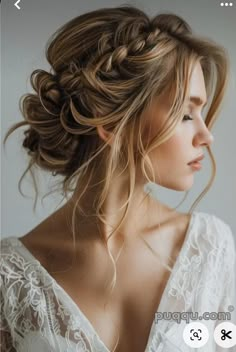 an image of a woman with long hair and braids on her head, looking off to the side