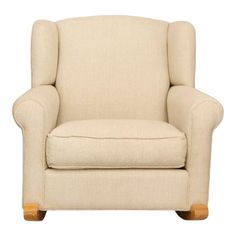 a white chair with wooden legs and a beige upholstered arm rest on a white background