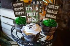 cupcakes with green frosting and happy it's a party jack on top