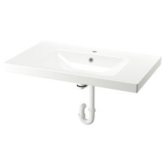 a white bathroom sink sitting on top of a counter next to a faucet