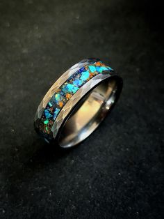 Made of faceted "hammered" fisnished tungsten core. "Bahama blue" crushed opal, golden brass shavings, blue and golden gold foil and assorted pigments inlay. Blue Opal Promise Ring, Adjustable Blue Opal Ring, Blue Crush, Bahama Blue, Wolfram, Blue Opal, Gold Foil, Ring Shopping, Favorite Jewelry