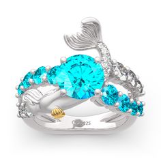 A magical, meaningful look, this ring is designed to sparkle for a lifetime. Inspired by the moment of a mermaid jumping into the sea, this exquisite design celebrates the spirit of freedom.A row of blue stones represents bright and beautiful color of the sea, while glistening white stones add more sparkle to the design. Every detail is well handcrafted to showcases the beauty and femininity of a mermaid. Create a wonderful memory when you present this stunning ring to the one you love.Carat Weight: 5.848 ctStone Size: 8,1.1,1.3,2.5,3,3.5,3.2,0.9 mmStone Type: Jeulia® StoneNumber of Stones: 24 Stone Color: Aquamarine Blue, Diamond WhiteStone Shape: RoundWeight: 7.6 gWidth: 16.75 mmHeight: 7.3 mmThickness: 4.1 mmMaterial: 925 SilverPlating Color: Silver, Yellow Gold Mermaid Rings, Mermaid Tail Cake, Mermaid Accessories, Goddess Of The Sea, Mermaid Ring, Vintage Halo, Jewelry Gift Guide, Silver Mermaid, Mermaid Jewelry