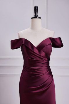 a purple dress on a mannequin dummy