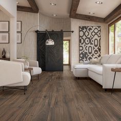 a living room with wood floors and white furniture