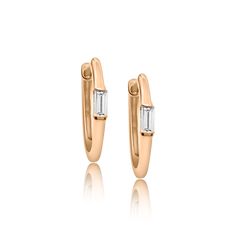 Huggies are better with Baguettes! These gorgeous14K Huggies feature a brilliant baguette diamond in each earring totaling approximately .09 CTS per pair Approximately 12mm Diameter Sold individually or as a pair Huggie Earring, Earrings Ear, Diamond Star, Ear Cuffs, Baguette Diamond, Affordable Luxury, Heart Bracelet, Huggies Earrings, Pave Diamonds