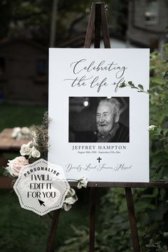 an easel with a sign on it that says celebrating the life of jerry hampton