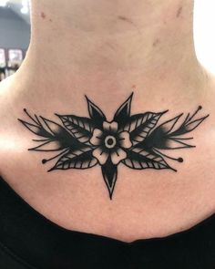 a woman with a black and white tattoo on her neck