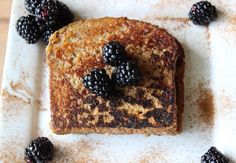 a piece of toast with blackberries on it