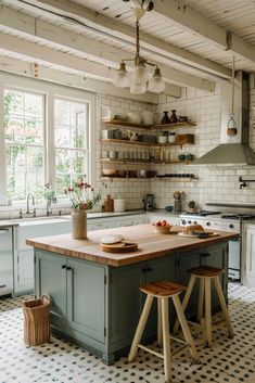 a kitchen with two stools in front of an island and open shelves on the wall