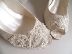 "Ivory lace wedge shoes for bride with beads and pearl embellishment. Stay comfortable in these low heel boho wedding shoes all night long, perfect for beach weddings on sand. Custom wedding gift, personalized engagement gift. Ivory bridal shoes are designed with embroidered lace. Pearls, shiny sequins and glass beads are used on the embroidery. Organza ribbons tie on the front. Custom details can be added on this design, soles can be personalized with your names and wedding date. They are made Embellished Lace Wedding Shoes, Elegant Wedding Shoes With Lace Work, Lace Bridal Accessories Fitted For Mother Of The Bride, Fitted Lace Bridal Accessories For Mother Of The Bride, Lace Wedding Shoes With Lace Work, Wedding Shoes With Lace Work, Elegant Embellished Lace Bridal Accessories, Cream Lace Wedding Shoes, Cream Lace Dress With Lace Bodice For Wedding