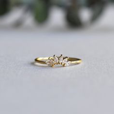 DESCRIPTION: >Add more sparkles to your solitaire ring with this enhancer. >Gold vermeil 925 Sterling Silver fully hallmarked. >Sterling silver is an almost pure metal made from 92.5% Silver. >Six, 3mm marquise cubic zirconia stones >Approx 1mm band width, 5mm length each leaves. FREE SHIPPING USA- All of our jewelry will arrive in custom packaging ready for gift giving. CARE: To prolong the color and shine of your jewelry, avoid contact with perfume, lotion, and water. Store in a Ring Wraps, Enhancer Ring, Perfume Lotion, Ring Enhancer, Tiara Ring, Ring Guard, Ring Marquise, Marquise Ring, Minimalist Ring