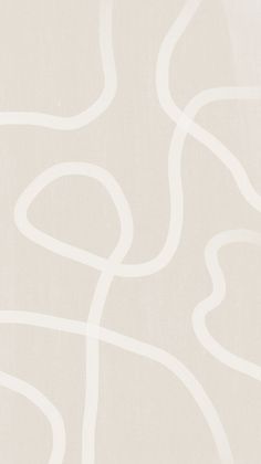 a white wallpaper with curved lines on it