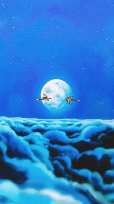 two birds are flying in front of the moon on a blue sky with white clouds