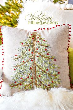 a pillow with a christmas tree on it and the words, christmas pillow love 2013