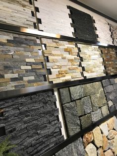 a display case filled with lots of different types of stone walls and flooring tiles