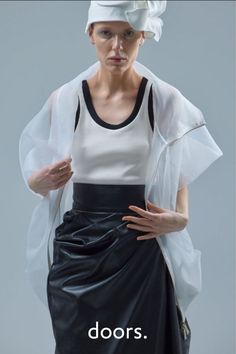 The unique skirt, made of black soft thin artificial leather, is destined to become an essential element in the wardrobe of stylish and daring women. Its texture and matte finish give the outfit a special sense of mystery and elegance, while the asymmetrical design adds originality and dynamism. Designed by European fashion designer JULIA ALLERT. Shop now at doors.nyc and #supportsmallbusiness Unique Skirt, Asymmetrical Midi Skirt, Unique Skirts, Midi Skirt Black, Asymmetrical Cut, Black Midi Skirt, Asymmetrical Design, Artificial Leather, Independent Designers Fashion