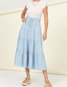 HIGH-WAIST GINGHAM PRINT MIDI SKIRT! CRAFTED WITH AN ELASTICIZED RUFFLED HIGH WAISTBAND WITH DRAWSTRING, THIS FLOUNCY SKIRT HAS TIERS THROUGHOUT, ENDING AT A RELAXED HEM. MATERIAL: 97% POLYESTER, 3% SPANDEXPRODUCT IS IMPORTED. DESIGNED IN THE USAMODEL IS 5' 9" TALL, 34C" CHEST, 24" WAIST AND 35" HIPS WEARING A SIZE SMALL PROCESSING TIME: 1-3 BUSINESS DAYS ESTIMATED DELIVERY TIME: 3-5 BUSINESS DAYS Fitted High Rise Blue Maxi Skirt, Blue High Rise Maxi Skirt For Spring, Blue Casual Maxi Skirt With Elastic Waistband, High Waist Blue Skirt With Elastic Waistband, Casual High Rise Blue Maxi Skirt, Blue Fitted Casual Maxi Skirt, Blue Tiered Skirt For Day Out, Light Blue Lined Skirt Bottoms Casual Style, Casual Blue Maxi Skirt