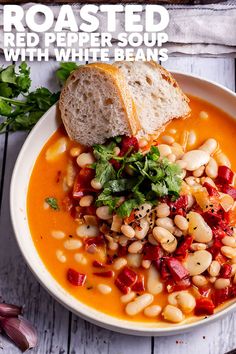 a white bowl filled with beans and bread