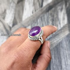 BhawaniJewelsAndGems Purple Amethyst Natural Ring, Sterling Silver Ring for Women, Statement Ring with Stone, Gemstone Boho Ring, Bohemian Jewelry Ring Style -> Band / Boho & Hippie Metal -> 925 Sterling Silver Ring Size - > All Sizes Are Available > Gift For Mom, Mother's Day Gift Ring A spinner ring, also known as a fidget ring or meditation ring, is a type of ring that features one or more outer bands that can rotate around the inner band of the ring. The outer bands may be made of a different material or have a different texture from the inner band, allowing for tactile stimulation and sensory feedback. Spinner rings are often used as a stress-relieving tool, as the repetitive motion of spinning the outer band can help to calm the mind and reduce anxiety. Some people also find spinner Adjustable Bohemian Purple Gemstones, Bohemian Crystal Ring With Gemstone Accents As Gift, Oval Purple Ring With Stones, Bohemian Amethyst Ring With Gemstone Accents, Adjustable Amethyst Ring With Gemstone Accents, Bohemian Rings With Gemstone Accents For Anniversary, Bohemian Amethyst Ring With Gemstone Accents As Gift, Spiritual Amethyst Ring With Gemstone Accents, Bohemian Crystal Ring With Stone Setting