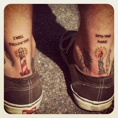 two people with matching tattoos on their feet, one has a lighthouse and the other says i will follow you