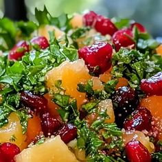 a salad with oranges, cranberries and herbs