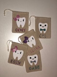 four bags with toothbrushes and bow ties on them